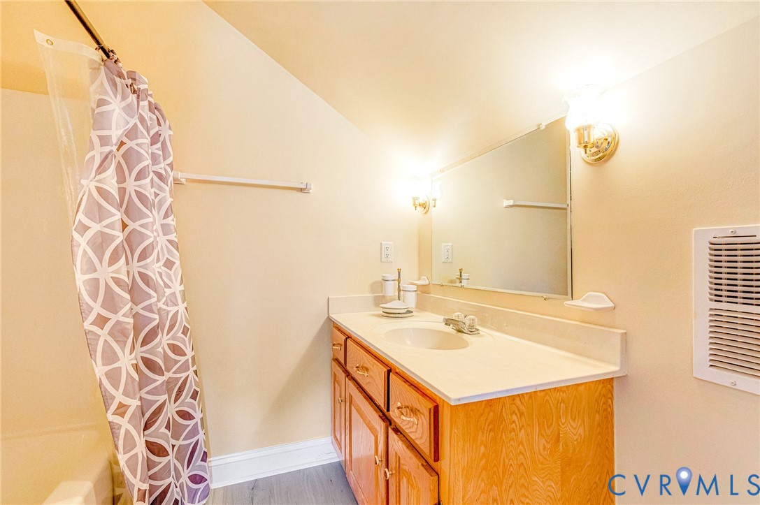 5629 West Quaker Road Disputanta, VA 23842 - Photo 26 of 43 Full bathroom with vanity, visible vents, shower /