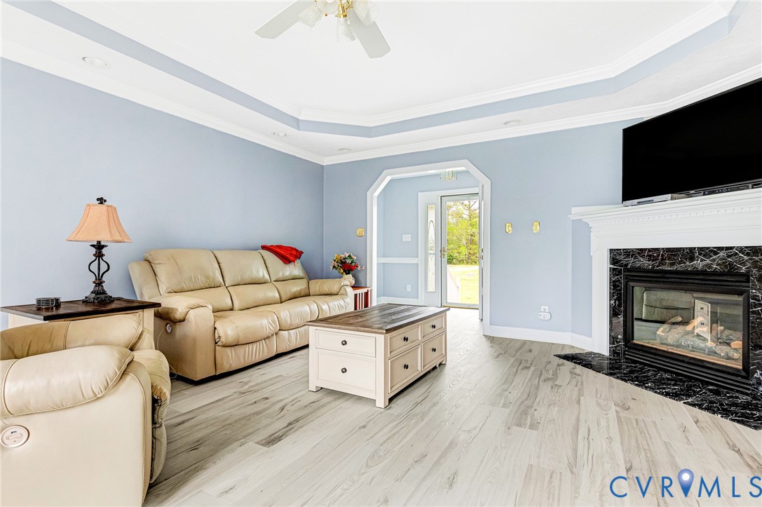 5629 West Quaker Road Disputanta, VA 23842 - Photo 4 of 43 Living room with light wood-style floors, arched w
