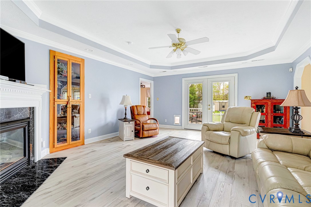 5629 West Quaker Road Disputanta, VA 23842 - Photo 6 of 43 Living room featuring ornamental molding, a Tray c