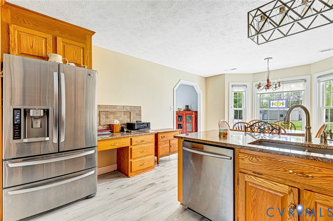 5629 West Quaker Road Disputanta, VA 23842 - Photo 9 of 43 Kitchen with a sink, a wealth of natural light, li