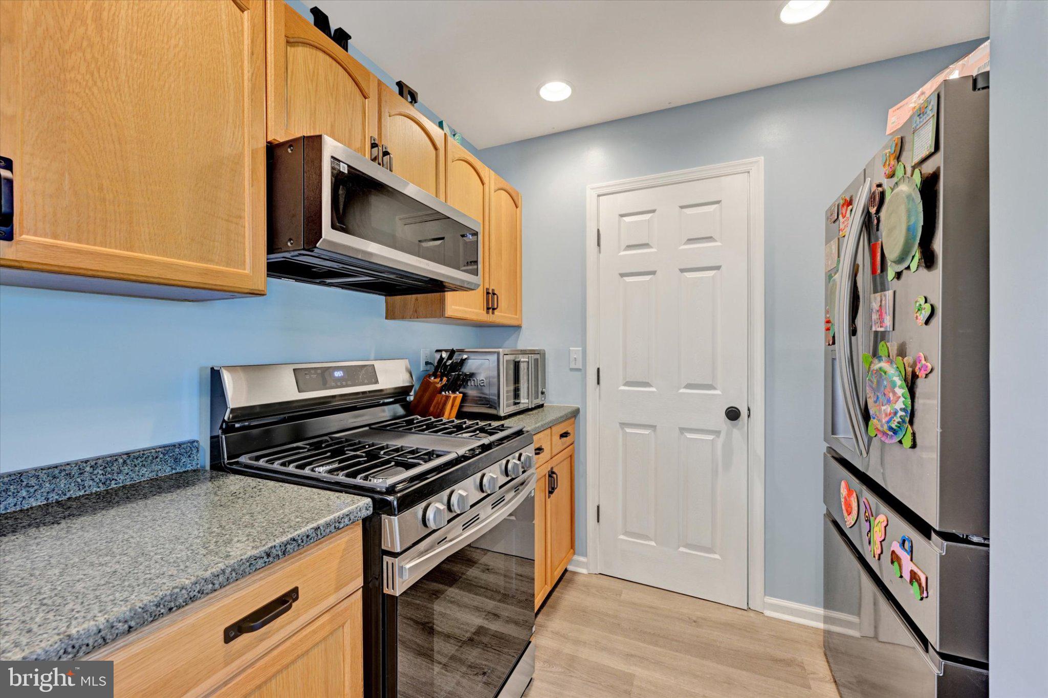 521 Riverside Drive Essex, MD 21221 - Photo 7 of 32 Modern kitchen with warm wood tones.
