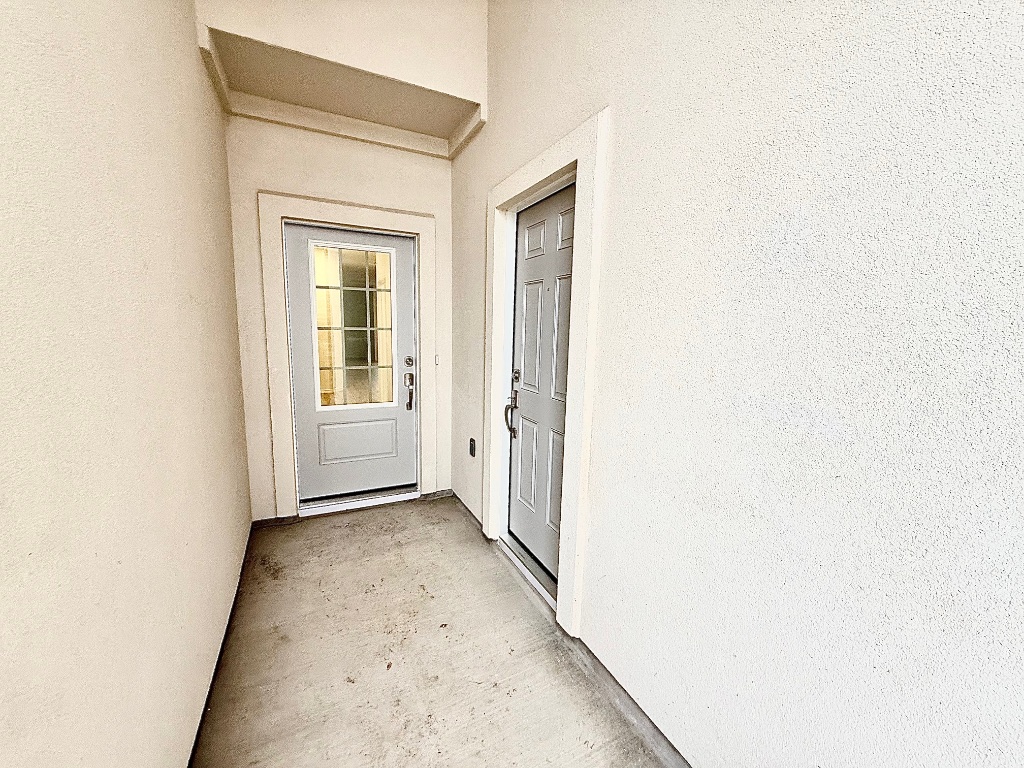 1724 Four Waters Loop Georgetown, TX 78628 - Photo 2 of 38 Property covered porch front entrance to the main house and the Gen X suite with the door on the right.
