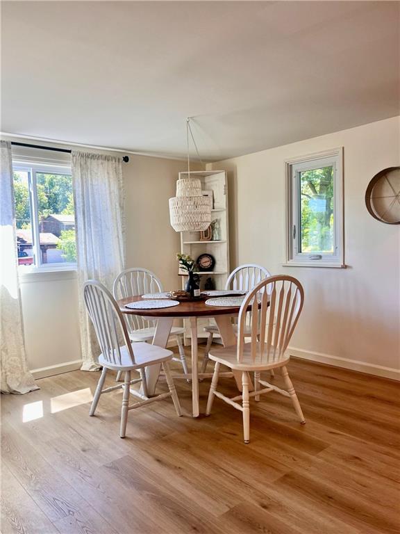 1419 Martin Road Tarentum, PA 15084 - Photo 11 of 31 a dining room with furniture a chandelier and wooden floor