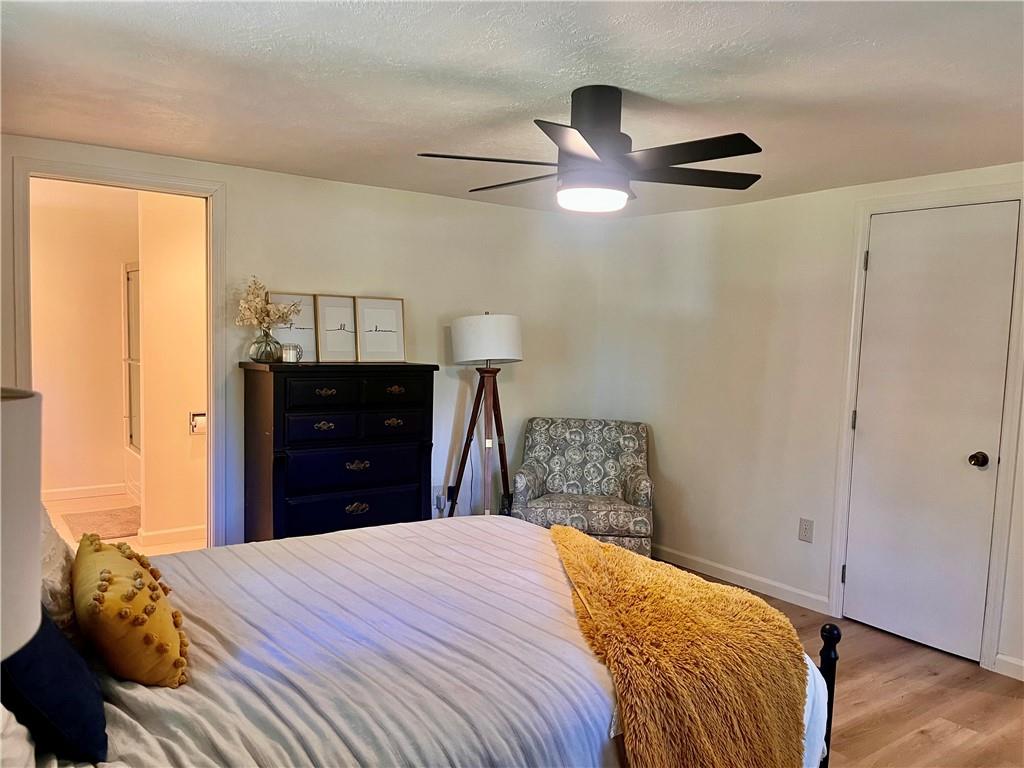 1419 Martin Road Tarentum, PA 15084 - Photo 17 of 31 a bedroom with a bed and a chandelier