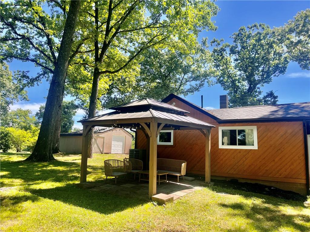 1419 Martin Road Tarentum, PA 15084 - Photo 29 of 31 a backyard of a house with yard and outdoor seating