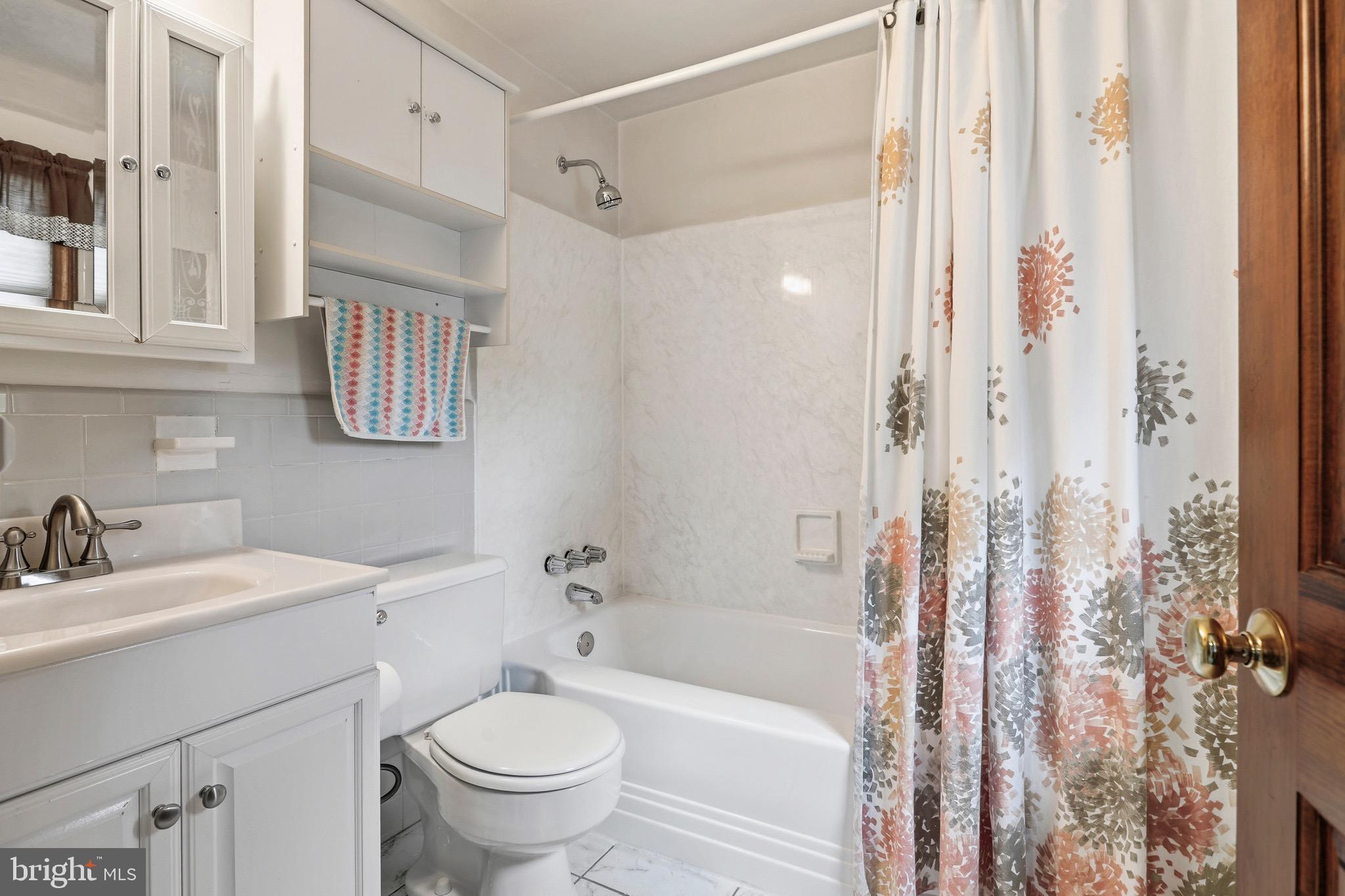527 Saxer Avenue Springfield, PA 19064 - Photo 25 of 33 a bathroom with a sink toilet and shower
