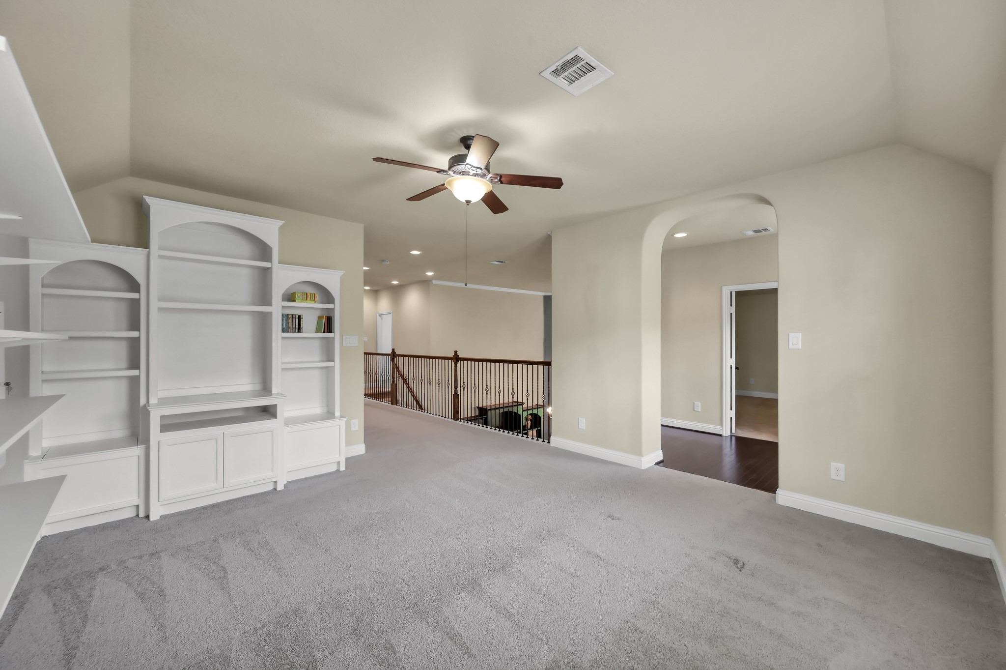23 Rancher's Trail Tomball, TX 77375 - Photo 25 of 40 Discover the inviting game room, featuring a charming nook perfect for a workstation, desk, or craft area, seamlessly connecting you to the media room for ultimate entertainment and productivity.