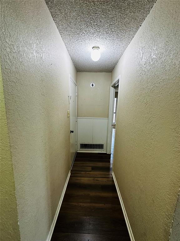 6741 Ridgetop Road North Richland Hills, TX 76182 - Photo 26 of 40 Split bedrooms-Hallway leading to Garage and Primary Bedroom