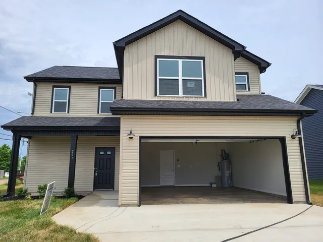 a front view of a house with a garage