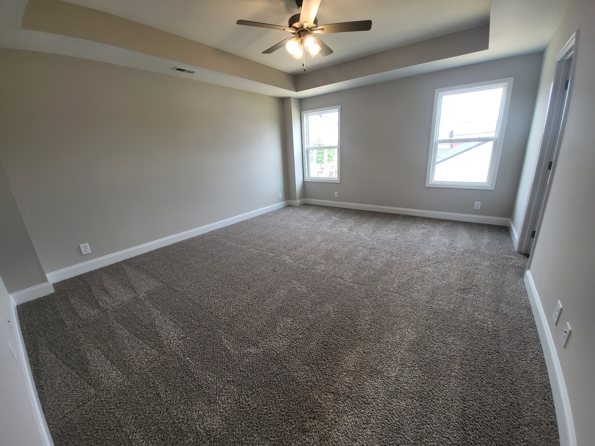201 King Road Clarksville, TN 37042 - Photo 11 of 26 en empty room with windows and chandelier fan