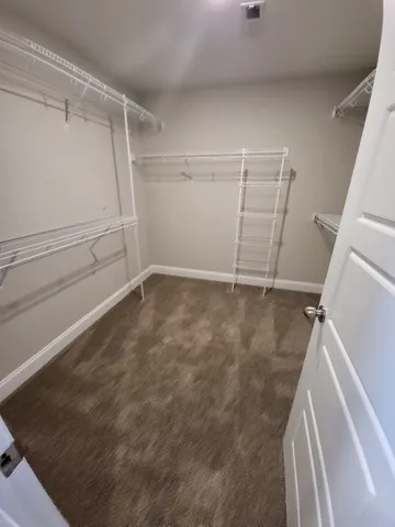a view of an empty walk in closet