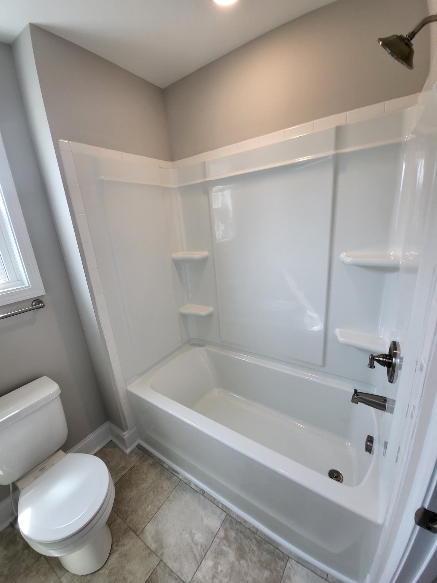 201 King Road Clarksville, TN 37042 - Photo 23 of 26 a white bath tub sitting next to a white toilet and sink