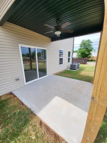 a view of a backyard with large trees