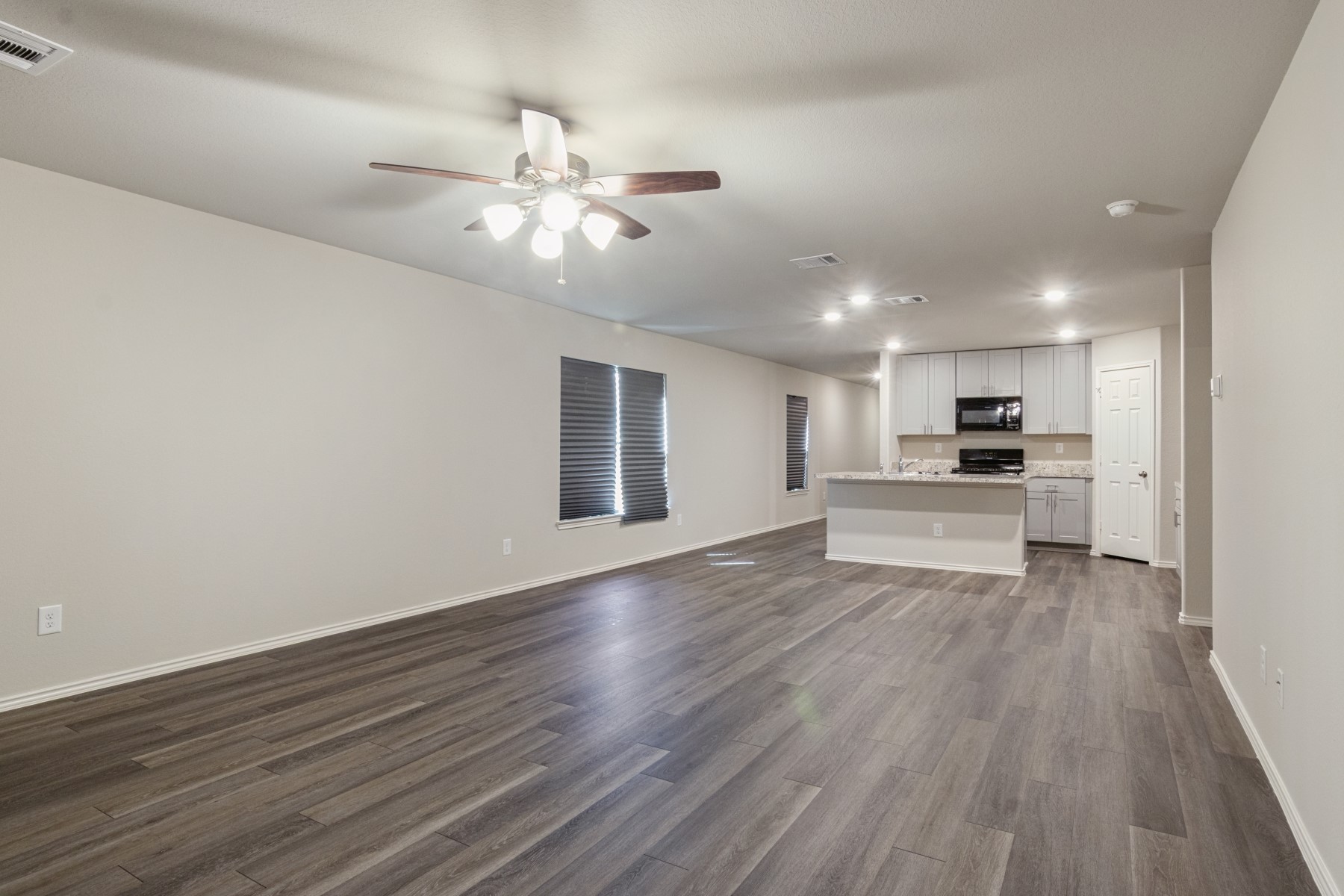 2250 Yelverton Ter Trail Spring, TX 77373 - Photo 8 of 30 a view of kitchen with cabinets and wooden floor