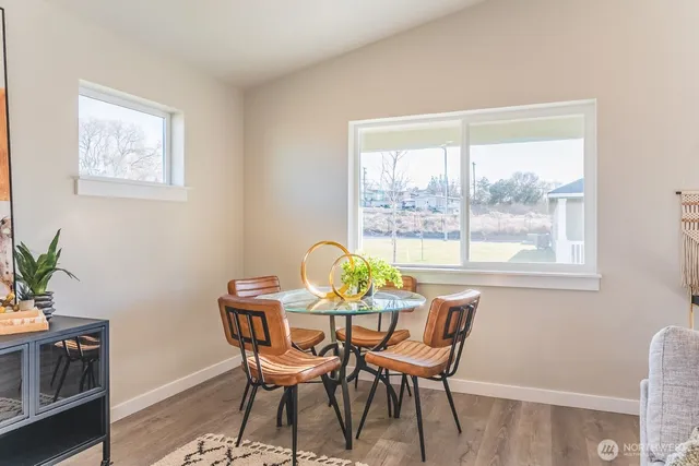 a dining room with furniture and window
