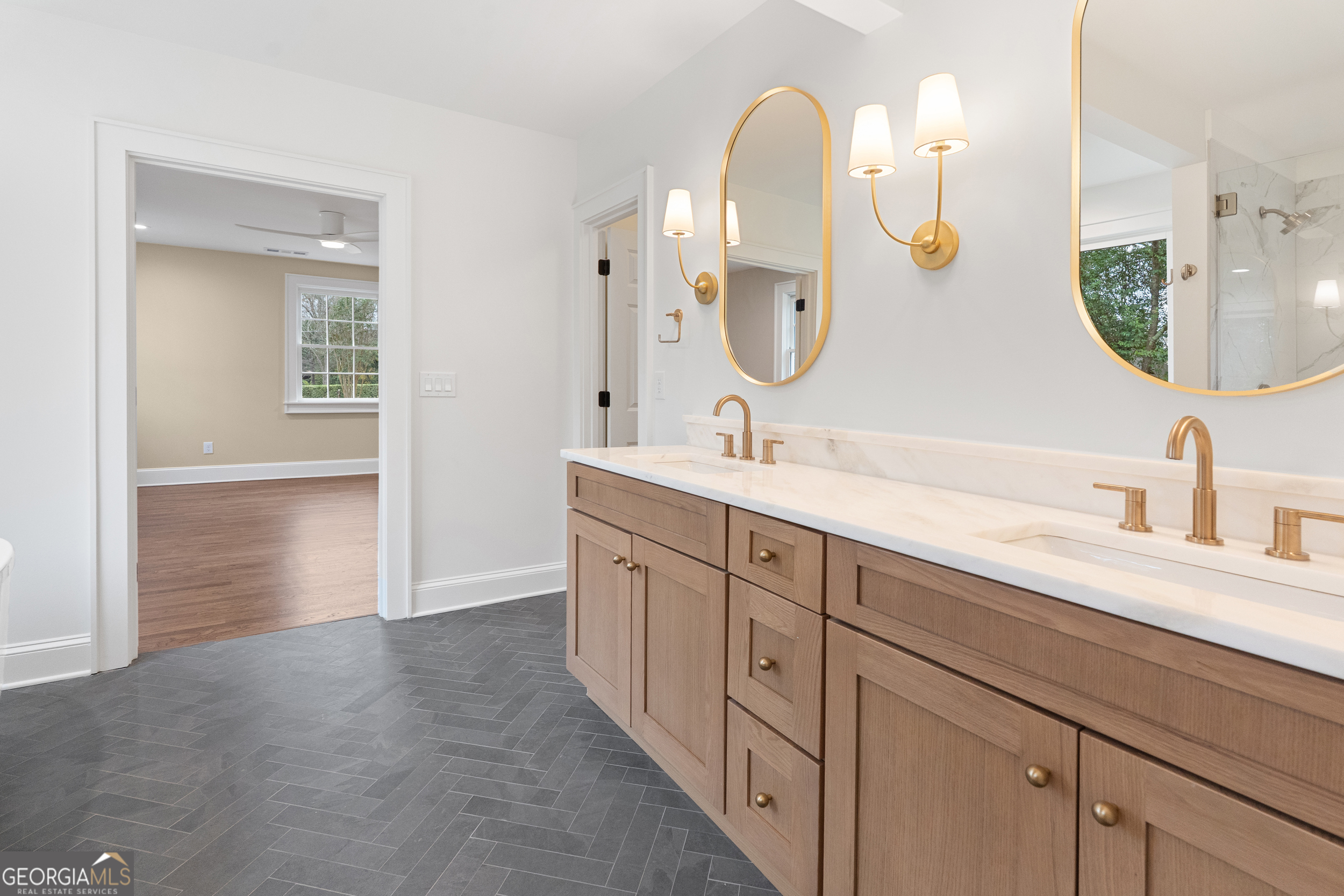 265 Springdale Street Athens, GA 30606 - Photo 24 of 43 a spacious bathroom with a double vanity sink and a mirror