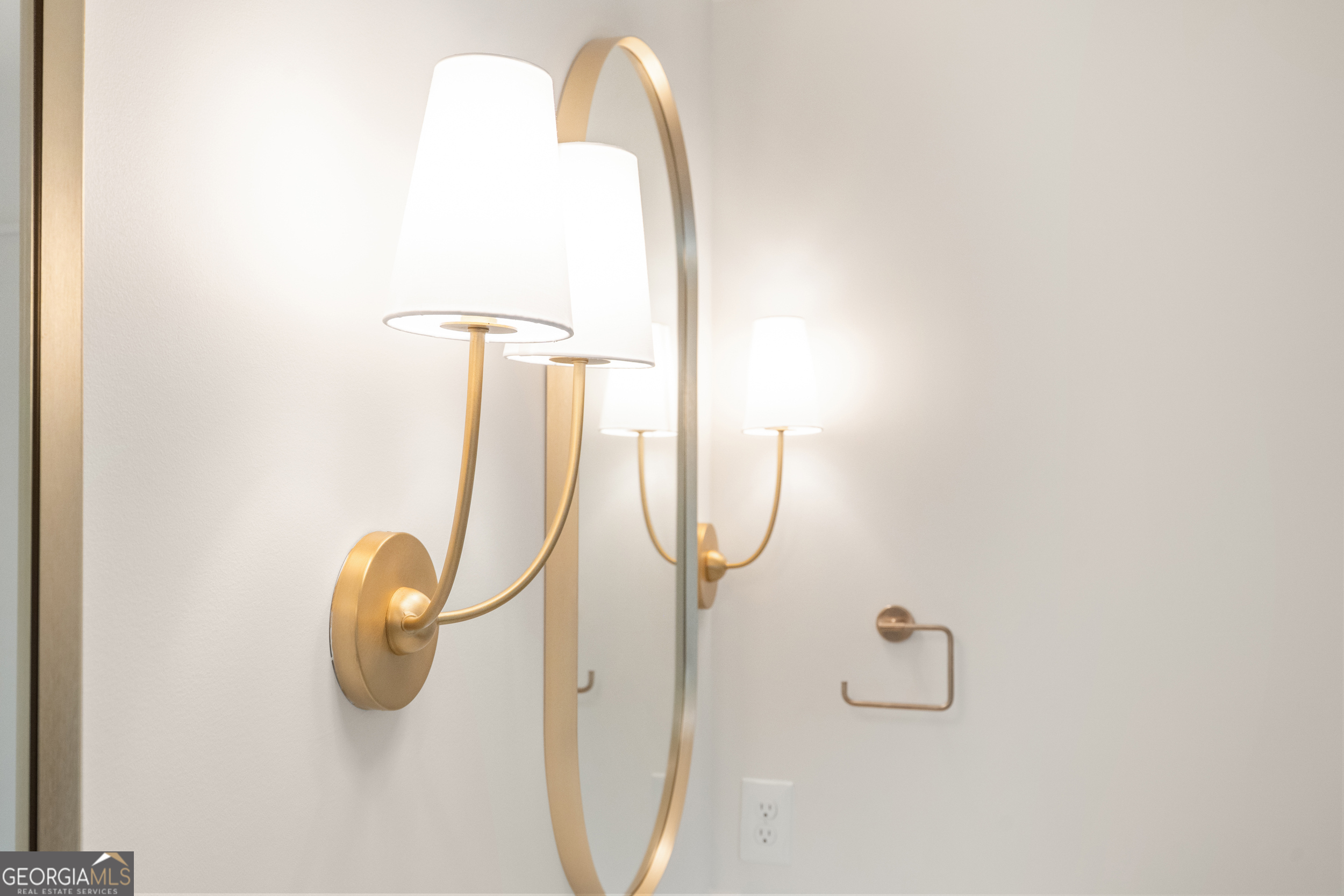 265 Springdale Street Athens, GA 30606 - Photo 26 of 43 a close view of light fixtures and a mirror of a bathroom