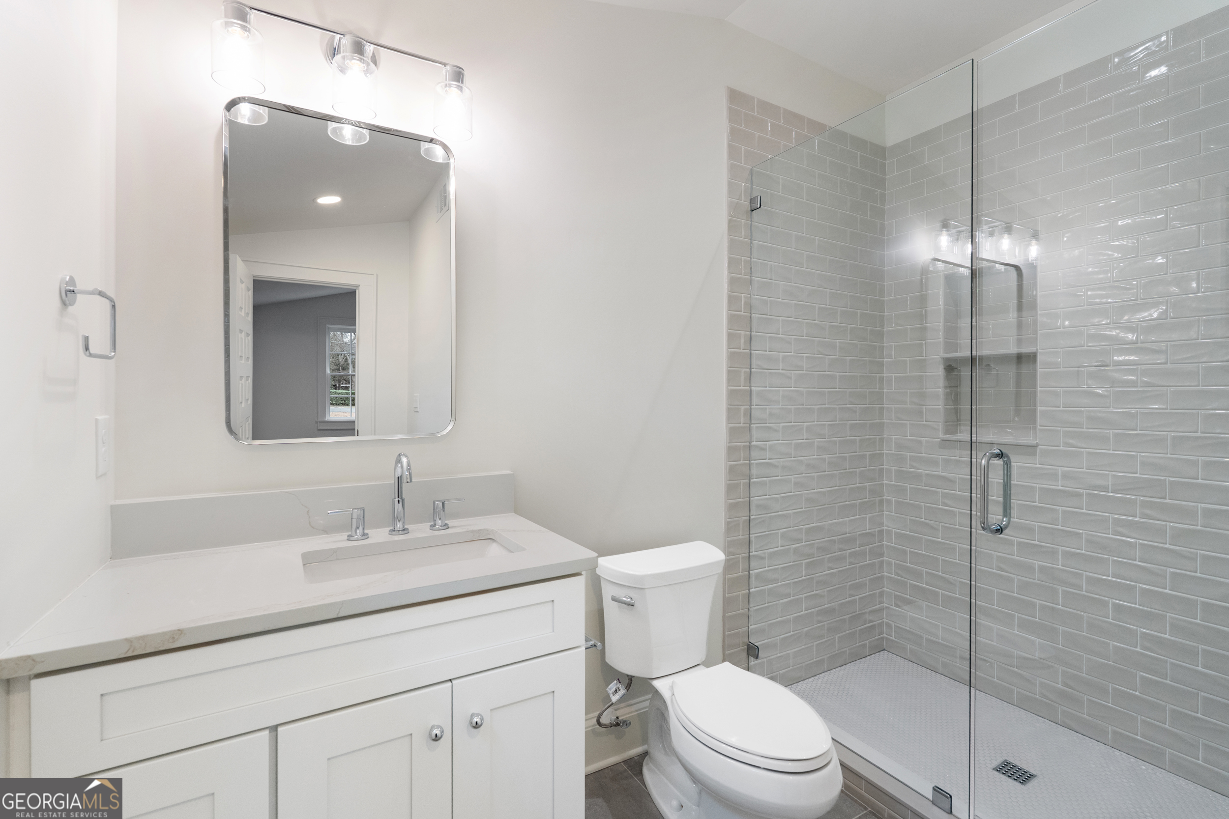 265 Springdale Street Athens, GA 30606 - Photo 29 of 43 a bathroom with a sink a toilet and shower