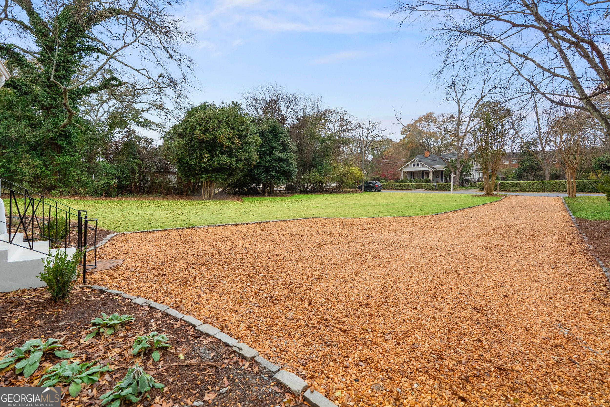 265 Springdale Street Athens, GA 30606 - Photo 3 of 43 a view of a field and trees around