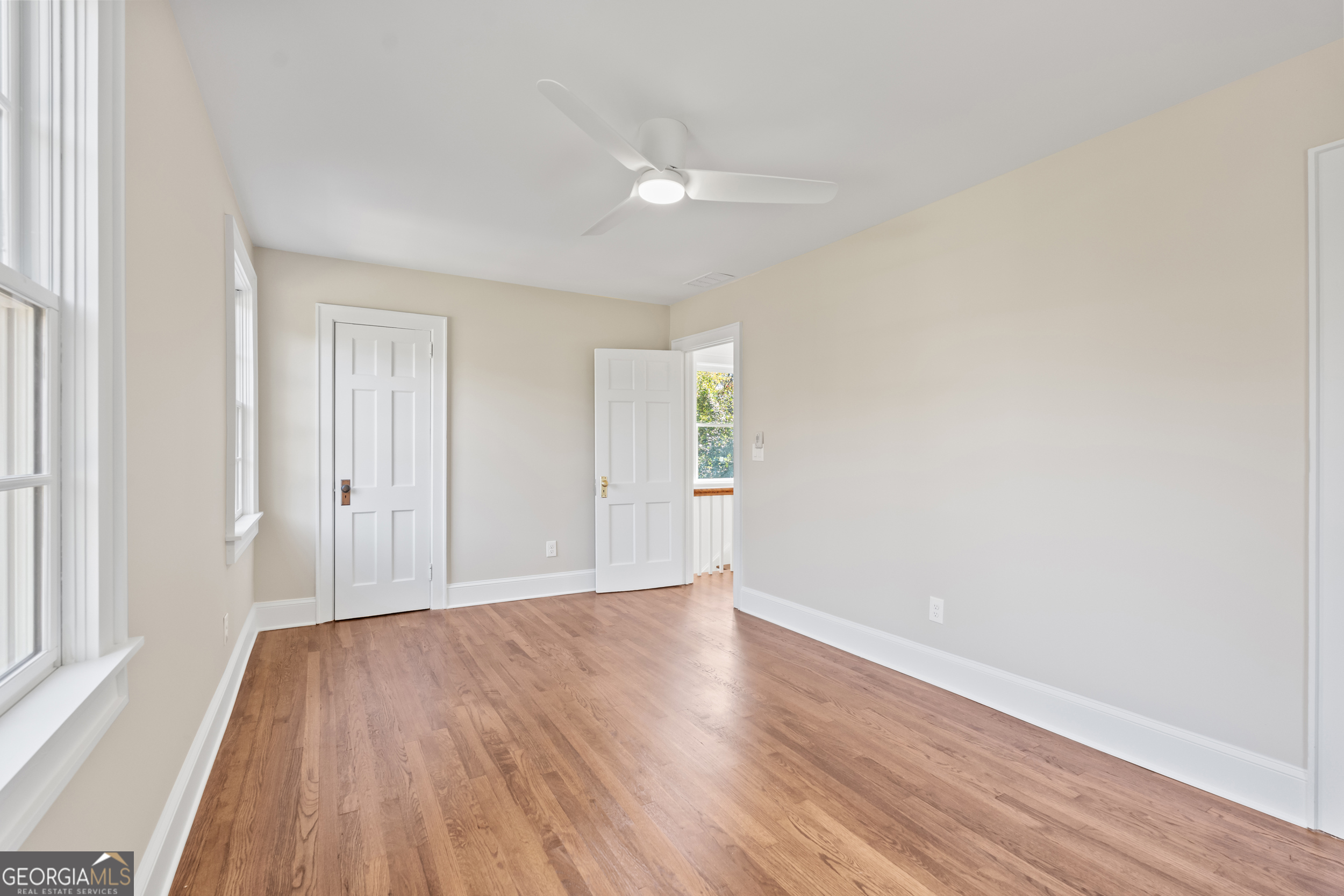 265 Springdale Street Athens, GA 30606 - Photo 32 of 43 a view of an empty room with wooden floor and a window