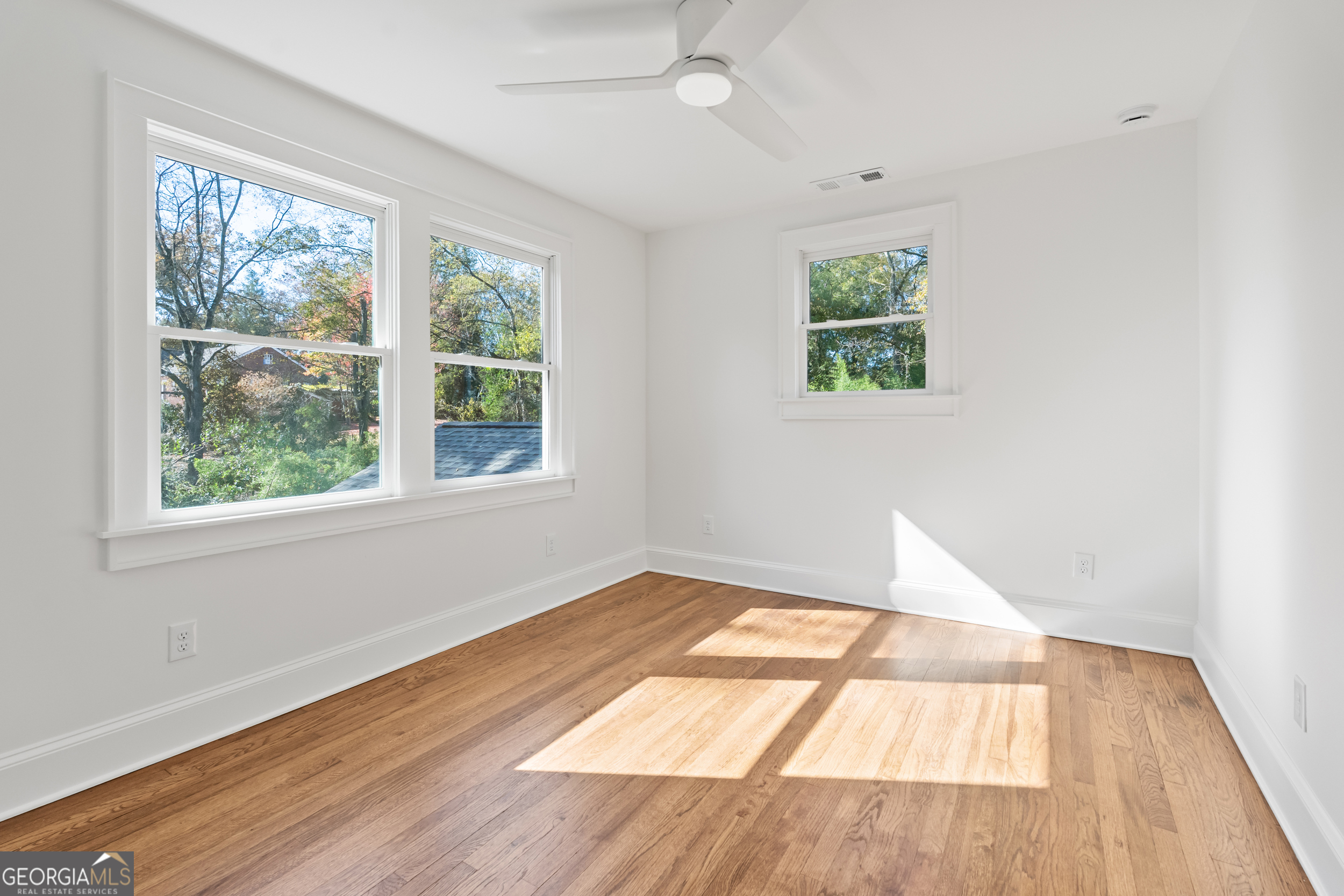 265 Springdale Street Athens, GA 30606 - Photo 36 of 43 an empty room with wooden floor and windows