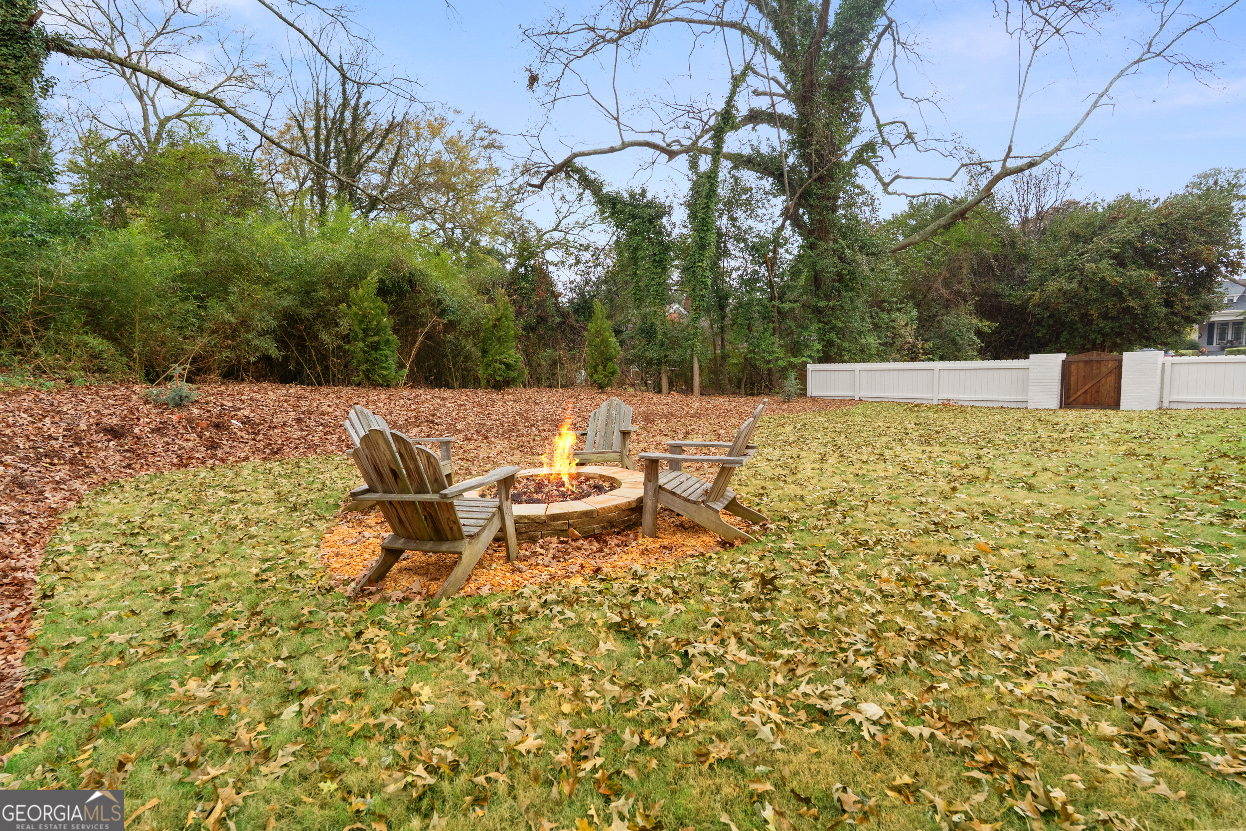 265 Springdale Street Athens, GA 30606 - Photo 38 of 43 a view of a patio with table and chairs under an umbrella