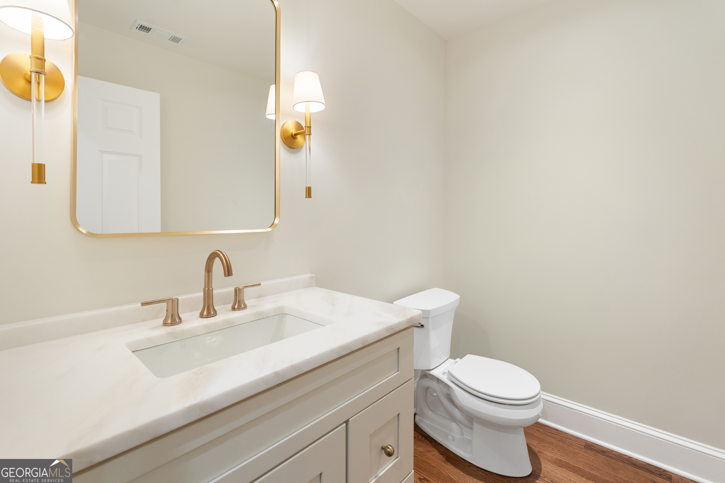 265 Springdale Street Athens, GA 30606 - Photo 6 of 43 a bathroom with a sink a toilet and mirror