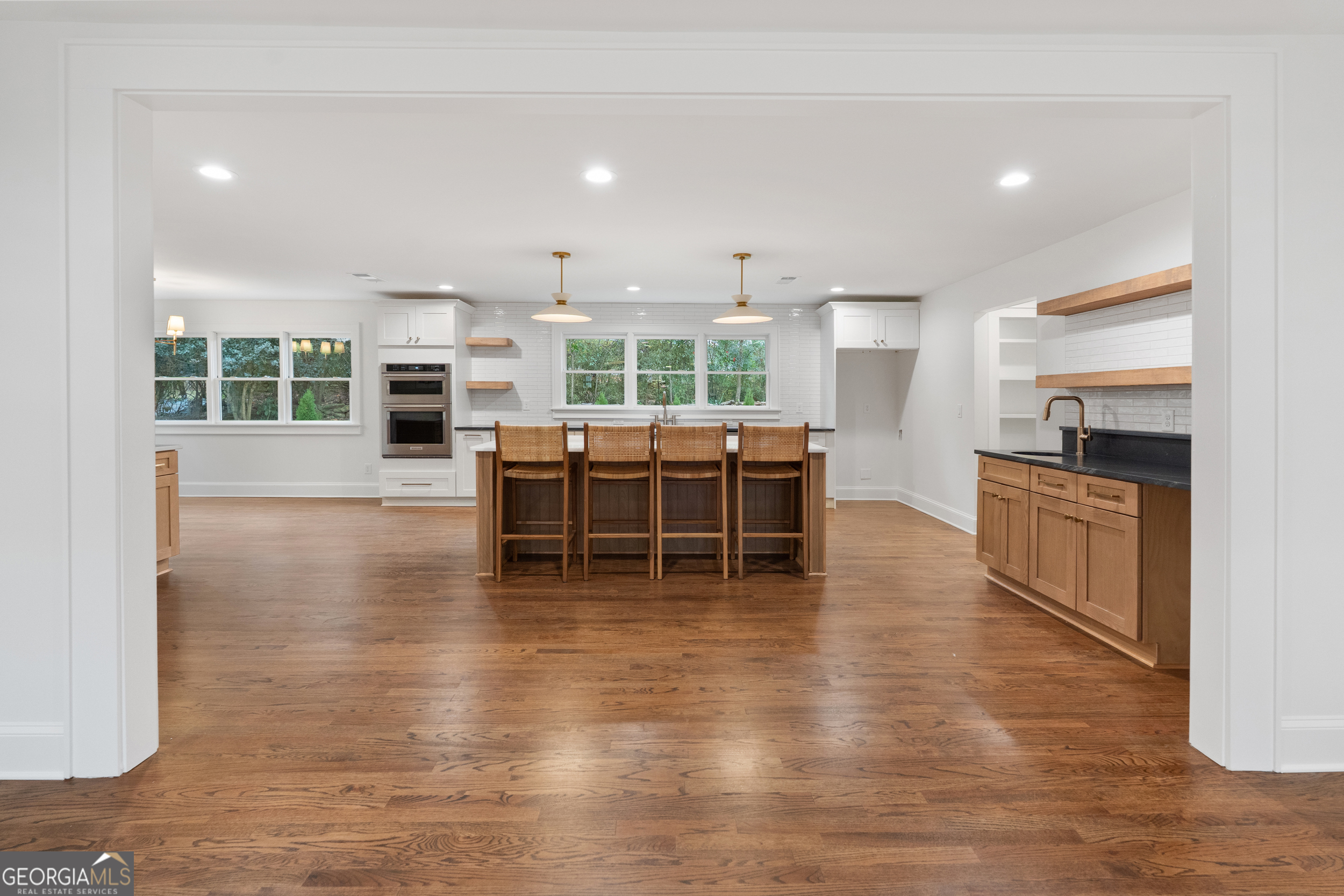 265 Springdale Street Athens, GA 30606 - Photo 7 of 43 a view of a kitchen with kitchen island a counter top space and cabinets
