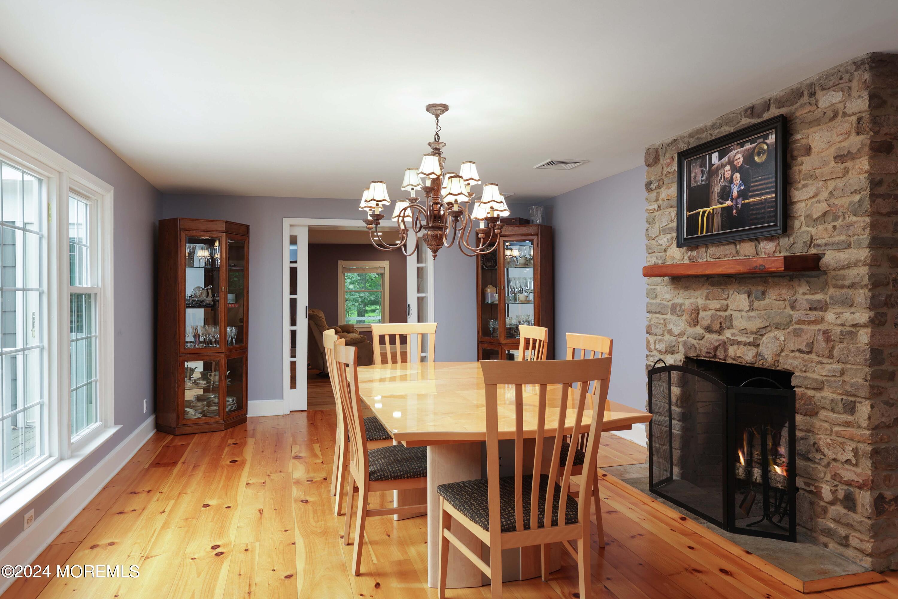 211 Georgia Road Freehold, NJ 07728 - Photo 15 of 41 a view of a dining room with furniture window and wooden floor