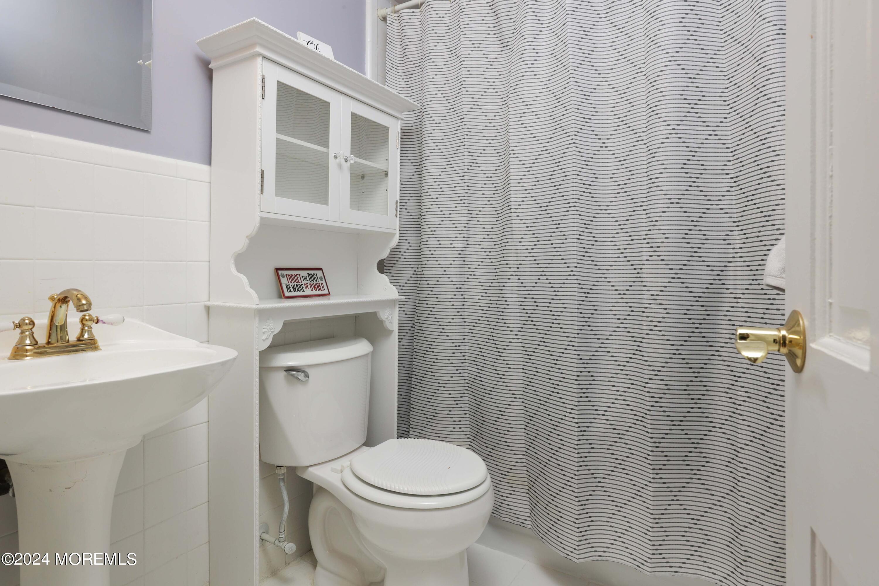 211 Georgia Road Freehold, NJ 07728 - Photo 17 of 41 a bathroom with a sink toilet and a mirror