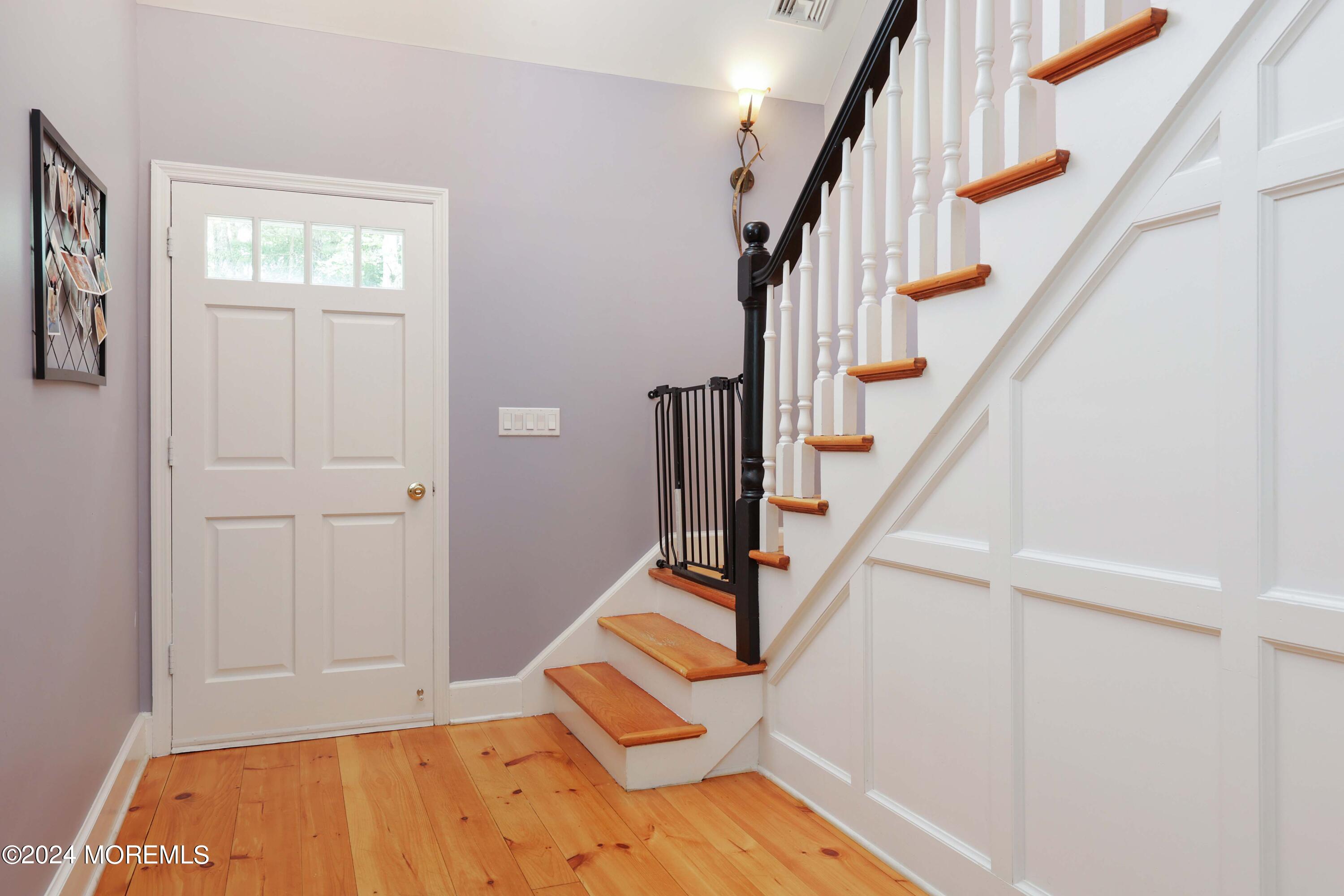 211 Georgia Road Freehold, NJ 07728 - Photo 20 of 41 a view of entryway with wooden floor and stairs