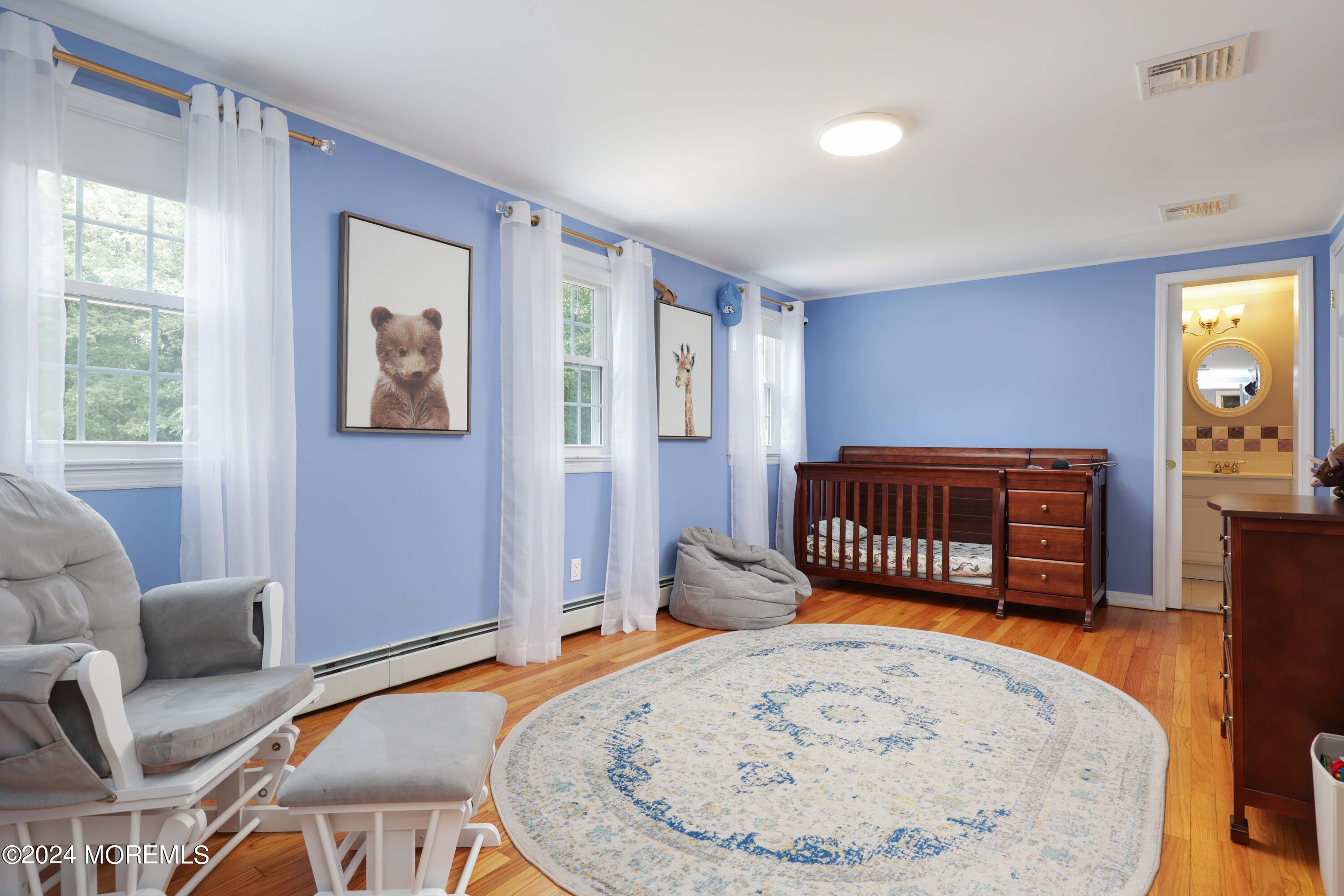 211 Georgia Road Freehold, NJ 07728 - Photo 23 of 41 a bedroom with a bed a couch and dresser