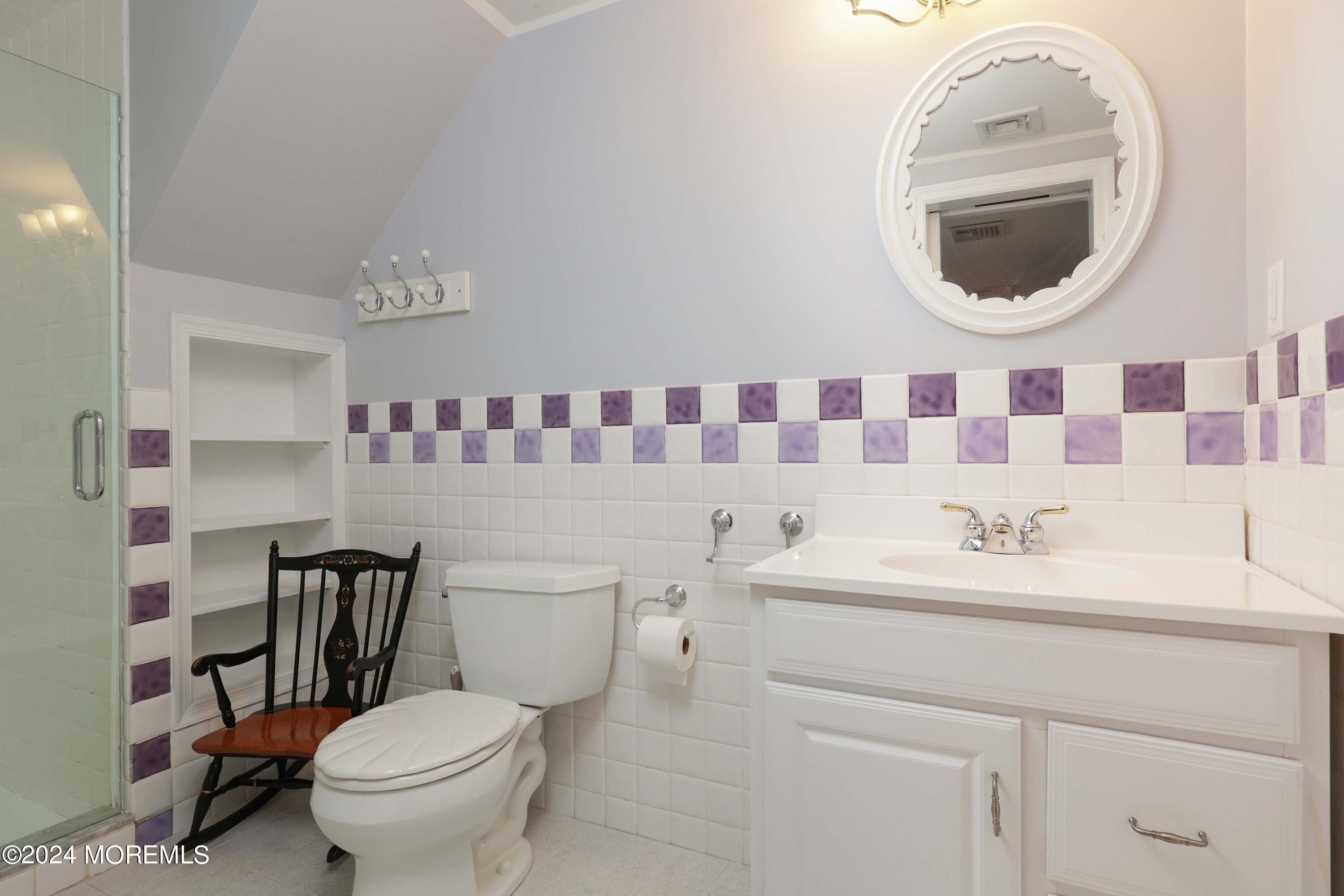 211 Georgia Road Freehold, NJ 07728 - Photo 24 of 41 a bathroom with a sink a toilet and a mirror