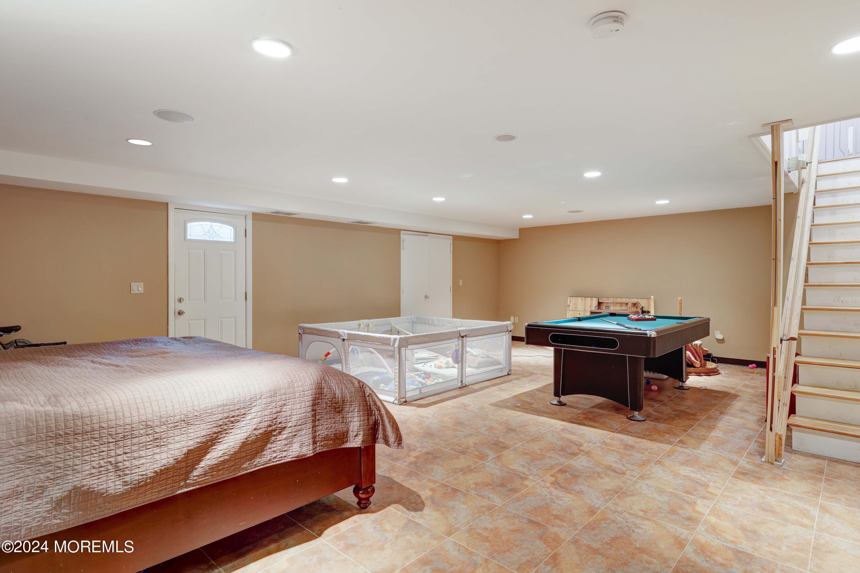 211 Georgia Road Freehold, NJ 07728 - Photo 28 of 41 a bedroom with a bed and a table
