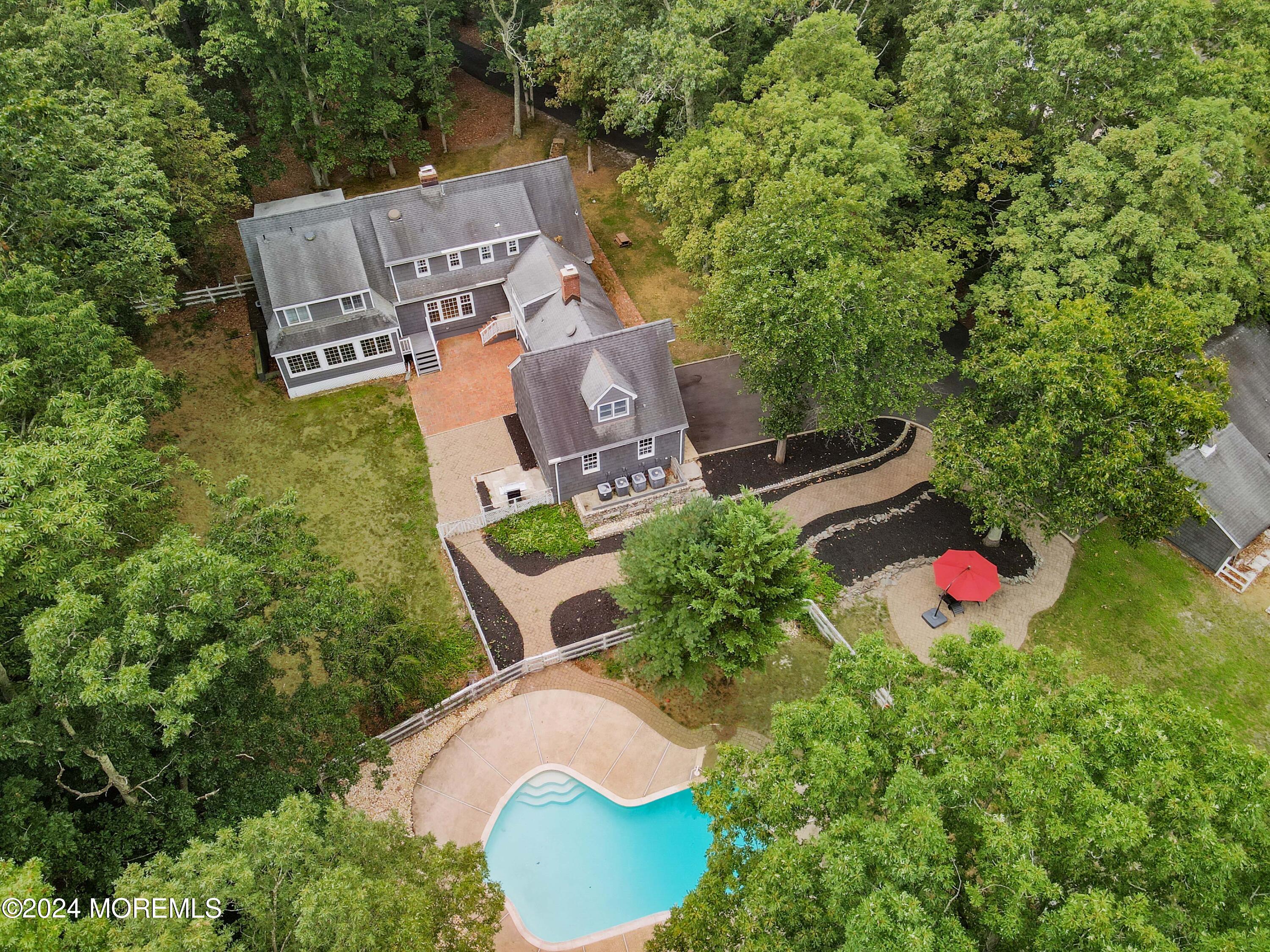 211 Georgia Road Freehold, NJ 07728 - Photo 3 of 41 an aerial view of a house with swimming pool and outdoor seating