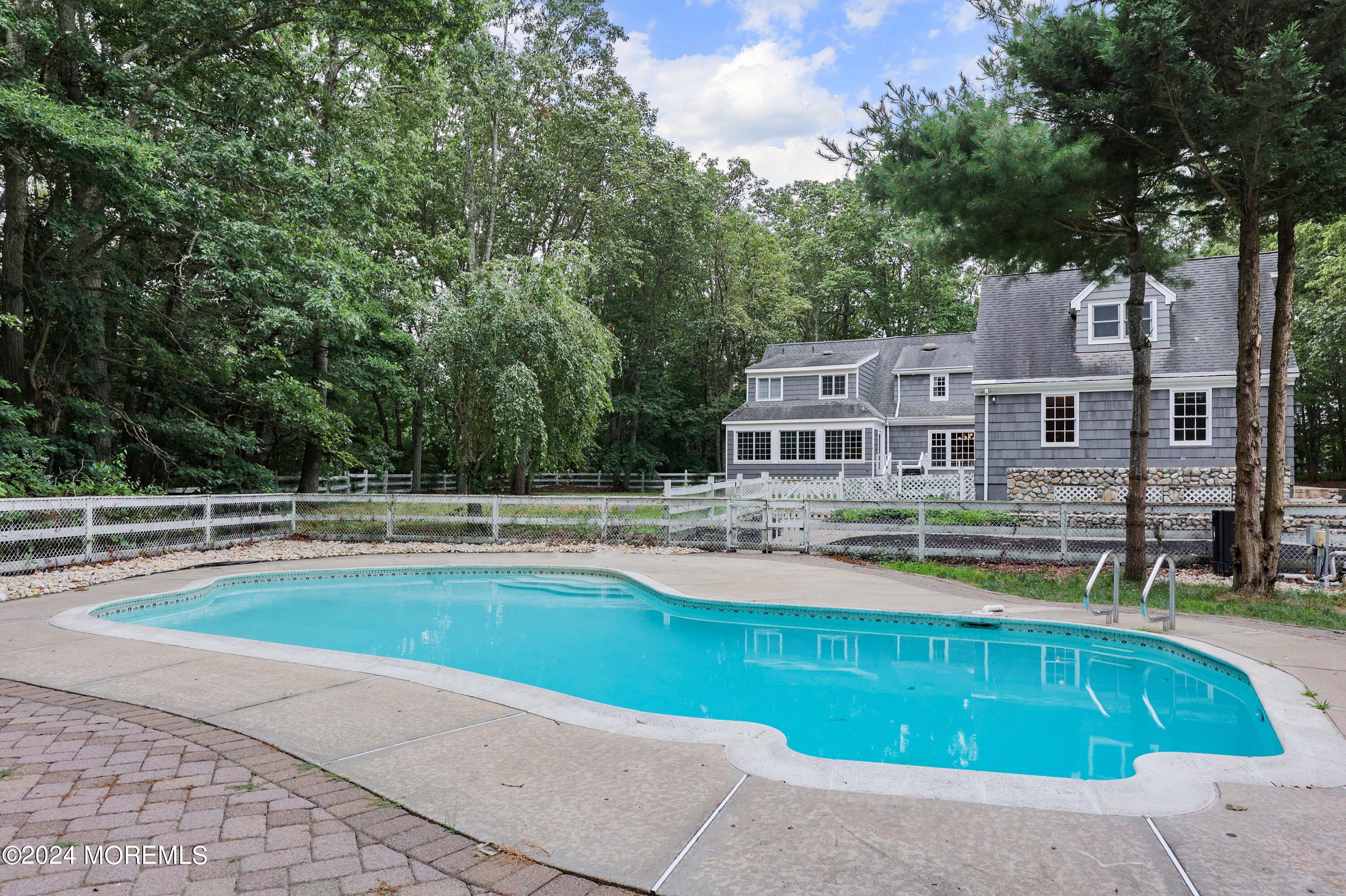 211 Georgia Road Freehold, NJ 07728 - Photo 34 of 41 a view of a house with swimming pool