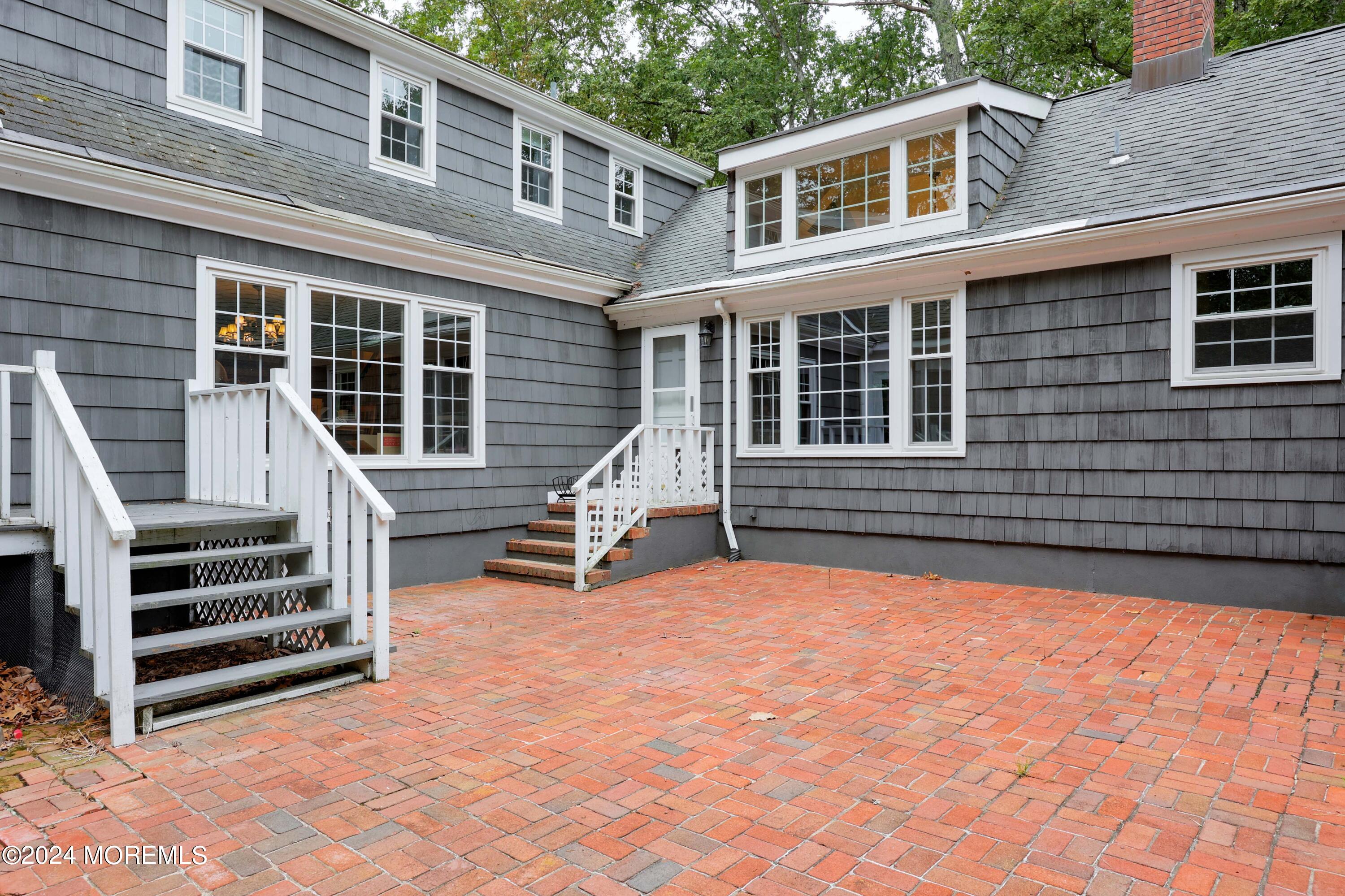 211 Georgia Road Freehold, NJ 07728 - Photo 5 of 41 a view of a house with a barbeque and wooden stairs