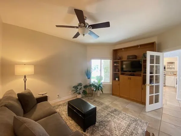 a living room with furniture and a window