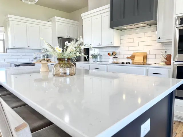 a kitchen with stainless steel appliances a stove and a refrigerator