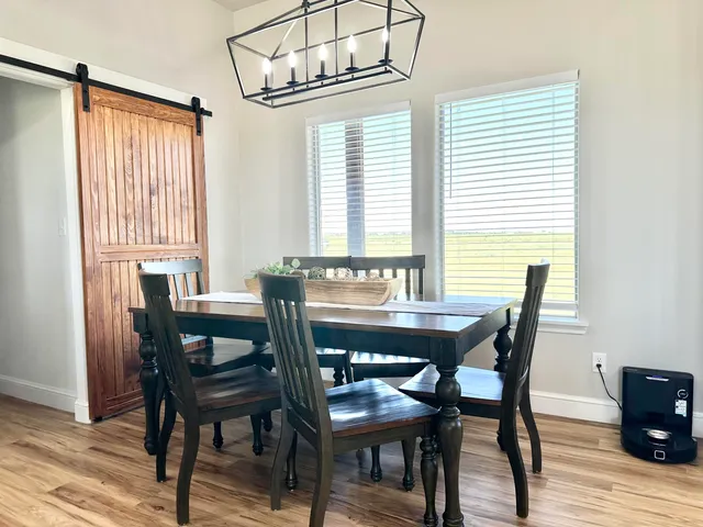 a bedroom with bed couch and window
