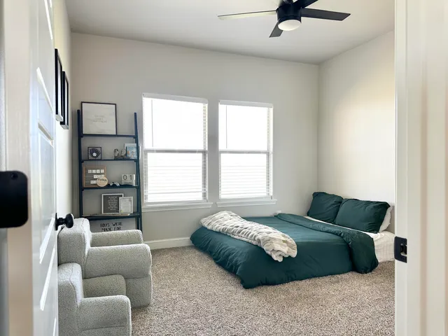 a bedroom with a bed and dresser