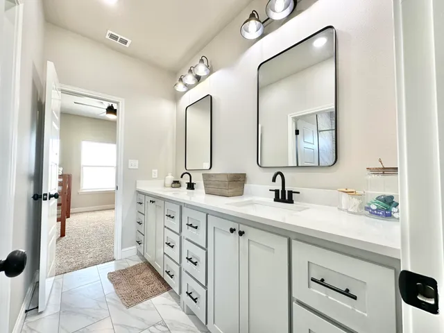 a kitchen with a sink and cabinets