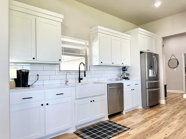 a kitchen with a sink and cabinets