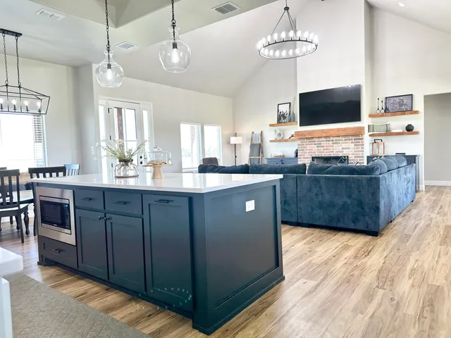 a kitchen with a sink cabinets and stainless steel appliances