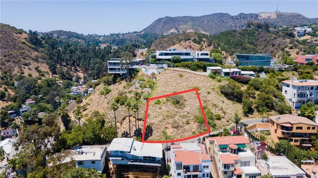an aerial view of residential houses and outdoor space