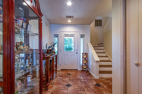 a view of room with hardwood floor and ceiling fan