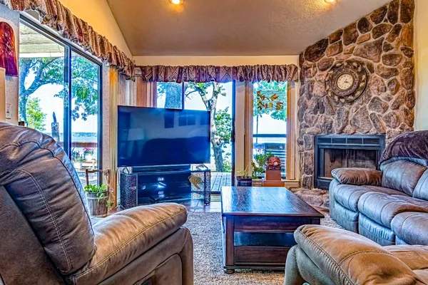 a view of living room with wooden floor and outdoor seating