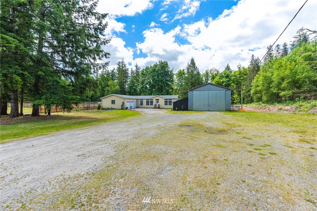 2065 East Pole Road Everson, WA 98247 - Photo 1 of 40 a view of a house with pool and a yard