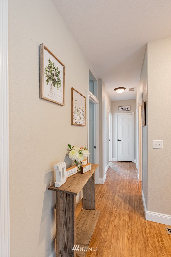 2065 East Pole Road Everson, WA 98247 - Photo 14 of 40 a view of a room with wooden floor and furniture