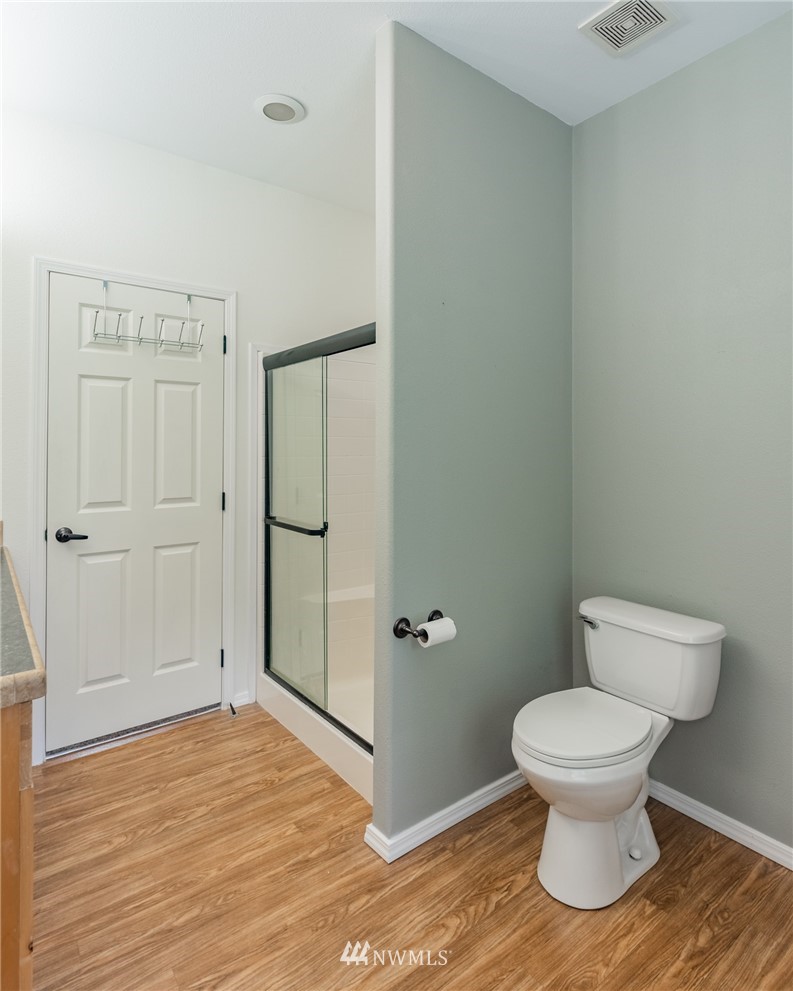 2065 East Pole Road Everson, WA 98247 - Photo 23 of 40 a bathroom with a toilet and a shower